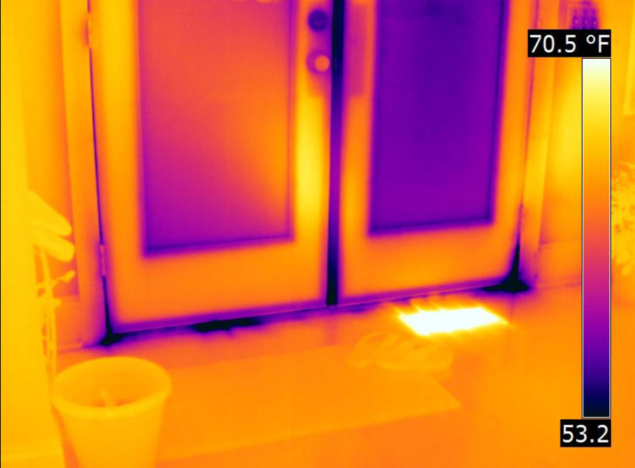 Thermal image of heat escaping through door