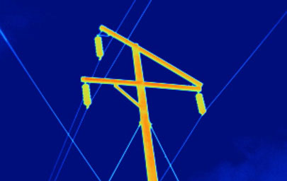 Thermal image of an electrical power line pole with standard lens